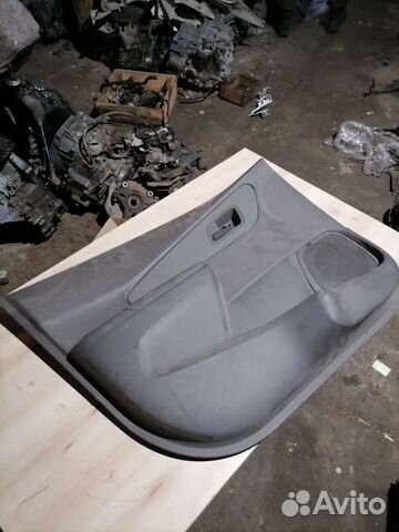 Обшивка двери передняя левая Шевроле Кобальт